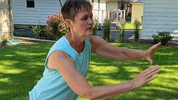 Jane doing tai ji quan in back yard