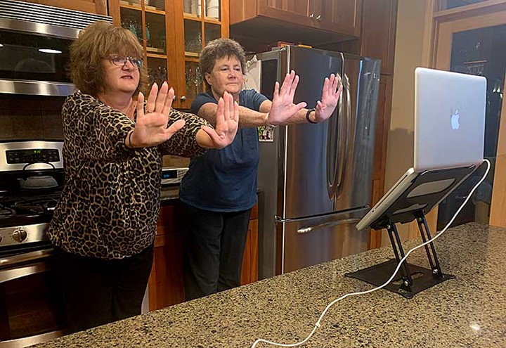 Patti and friend participating in Tai Ji Quan class