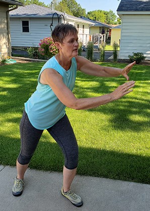 Jane practicing Tai Ji Quan moves