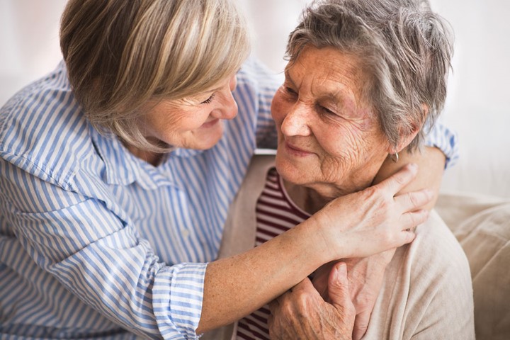 Mother and daughter embracing