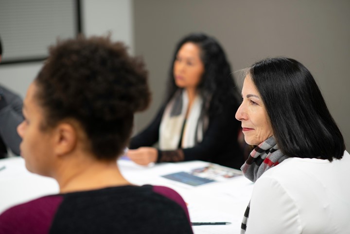 Older woman in a class listening